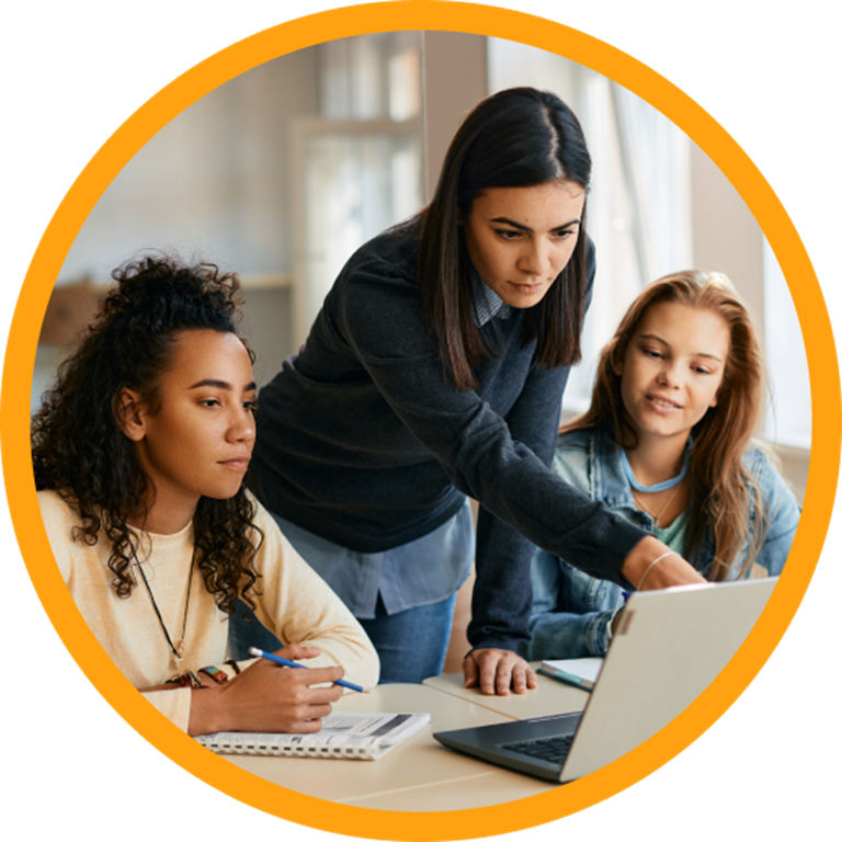 Teacher and two students using a laptop