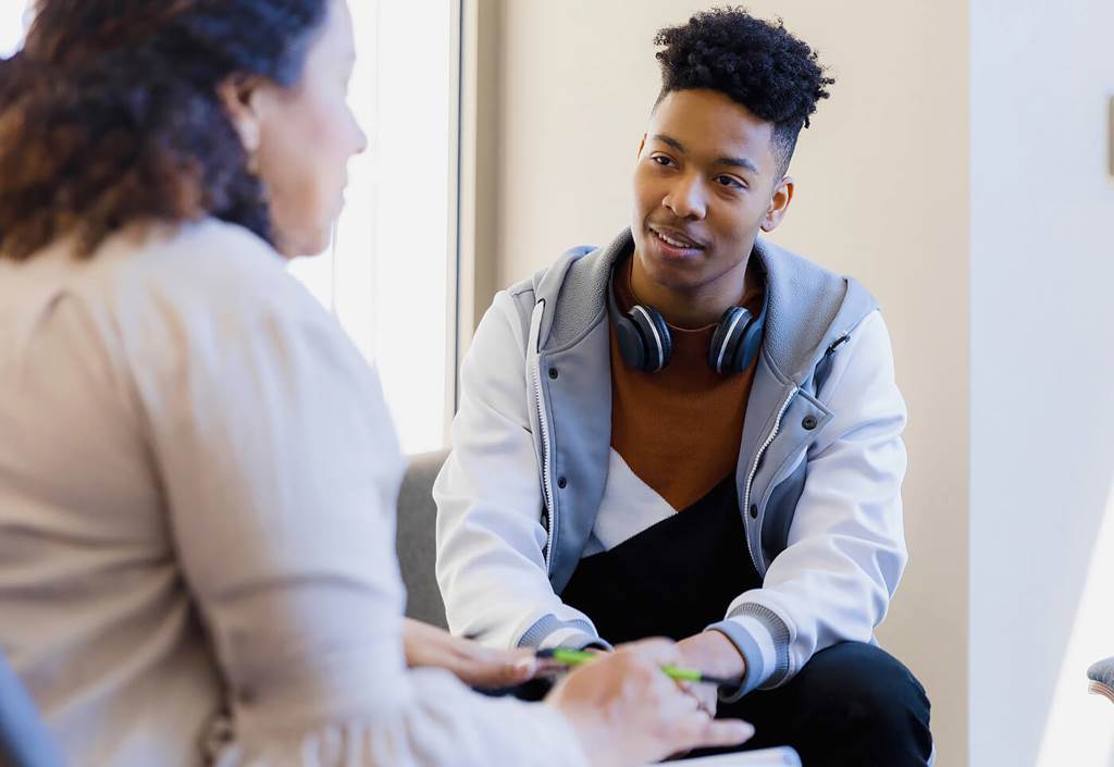 image of student listening to teacher