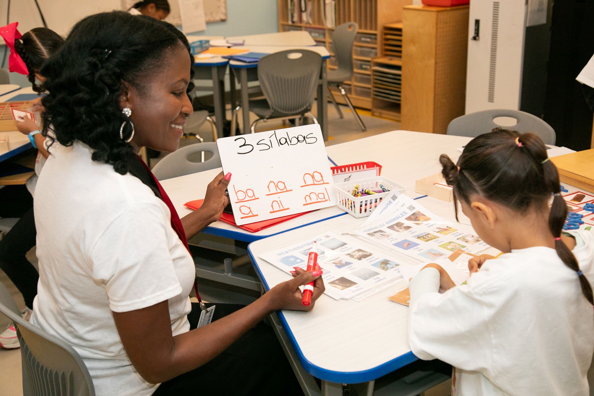 teacher working with student