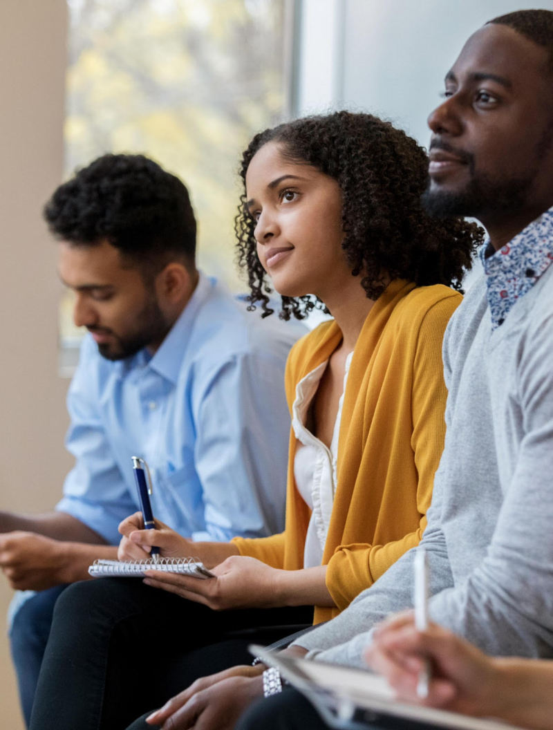 Man and woman listening, taking notes.jpg