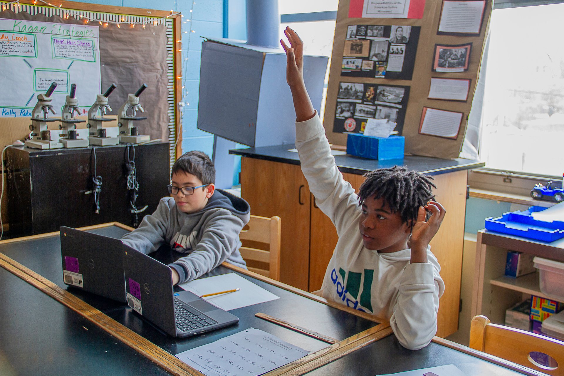 Two students working on laptops at Pritzker