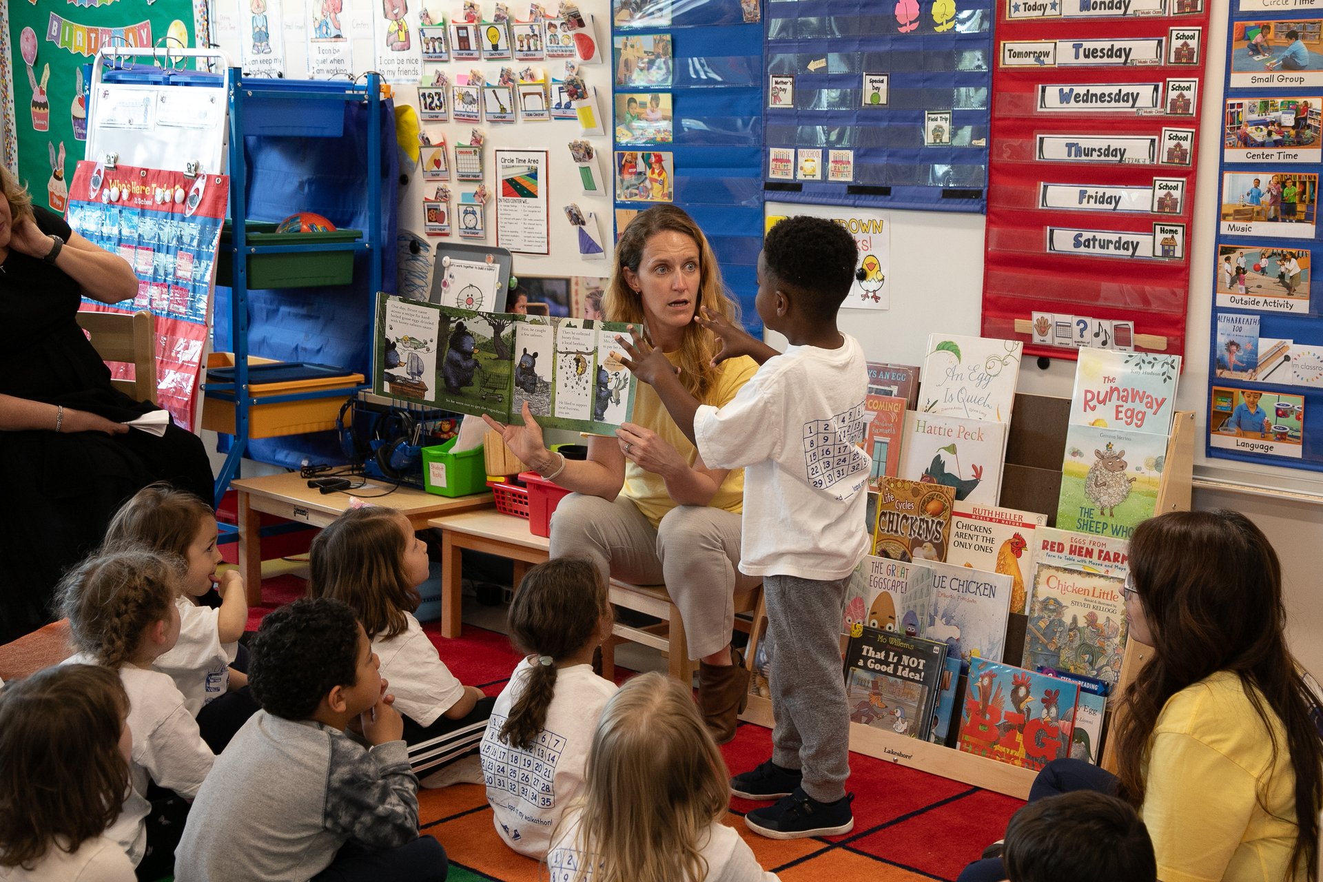 Group of young students listening to a story