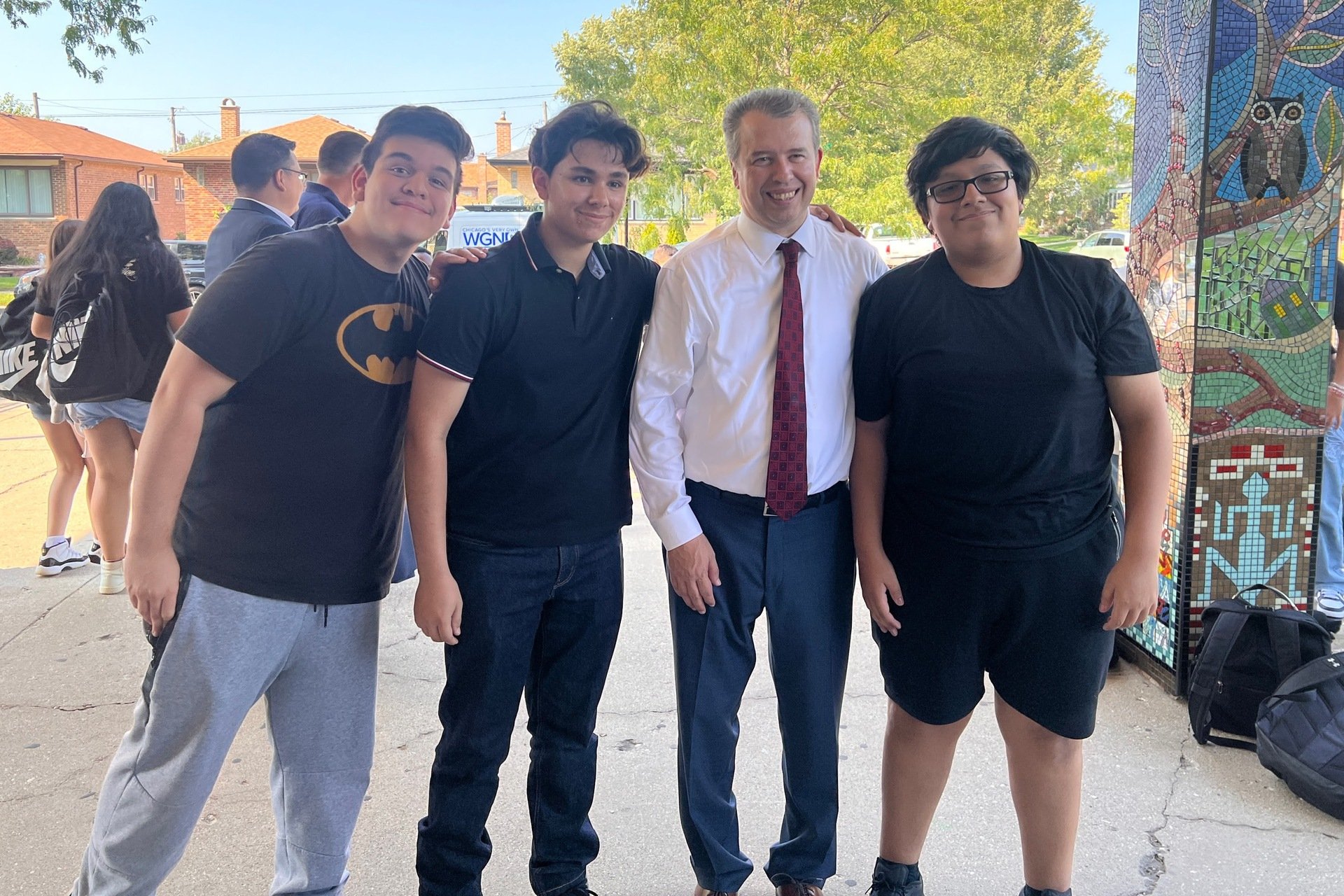 Pedro Martinez and three students posing for a photo