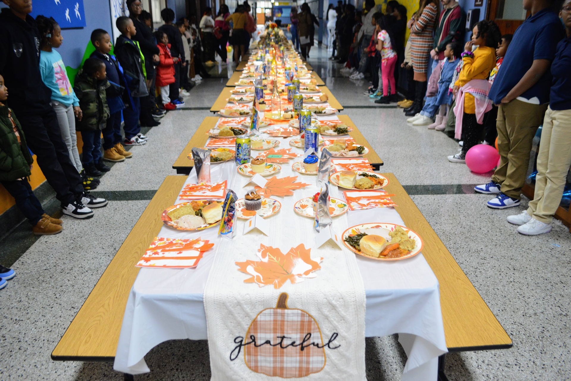 students alongside the table