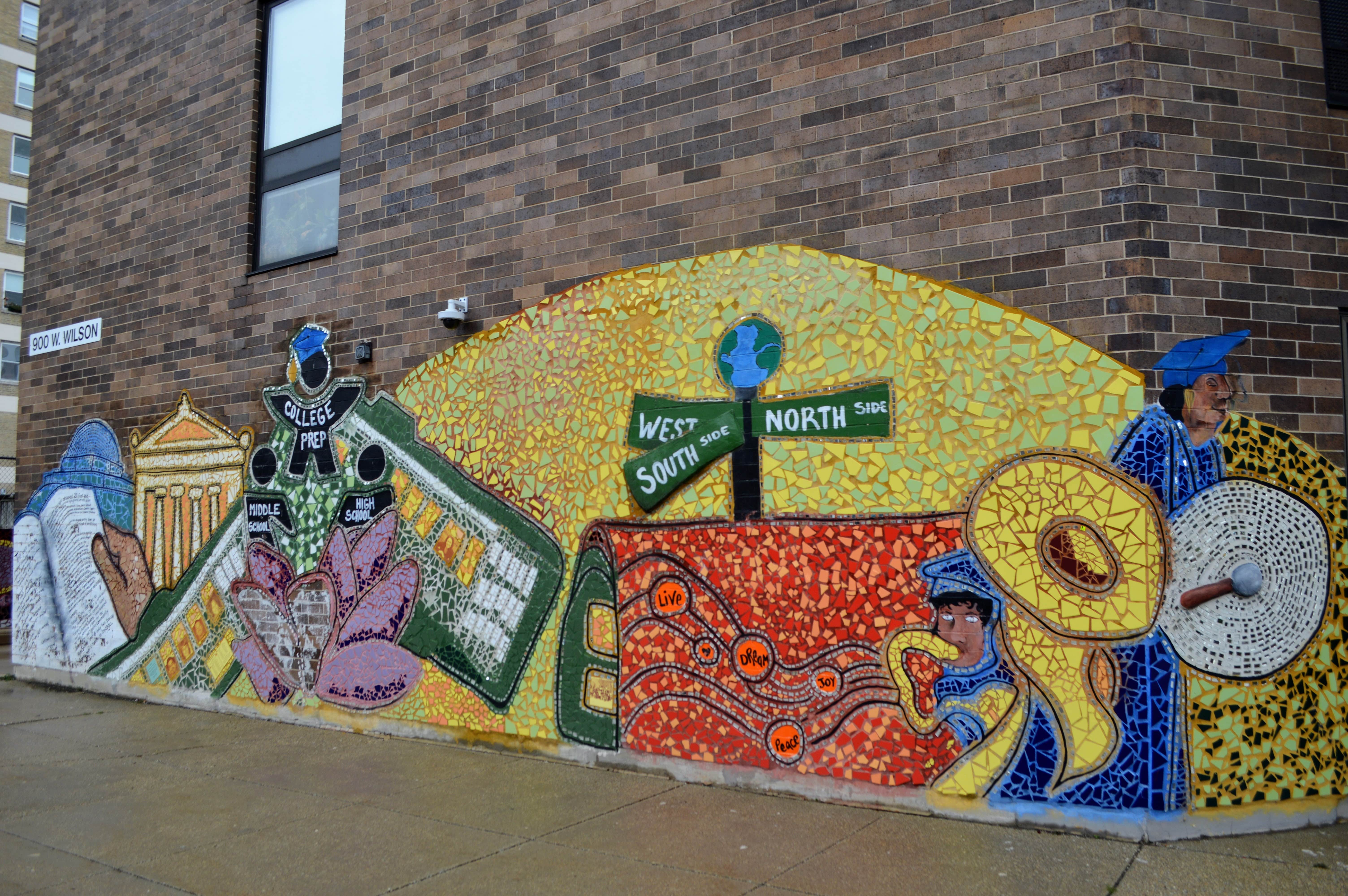 A mural on the side of Uplift Community High School