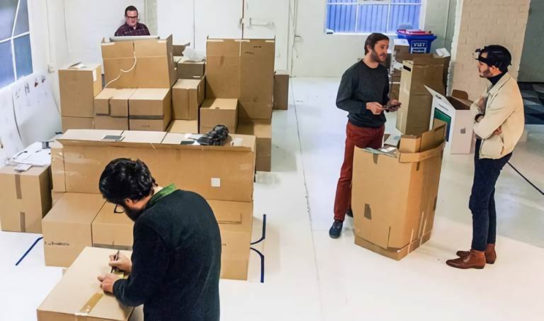 picture of men in storage room with boxes