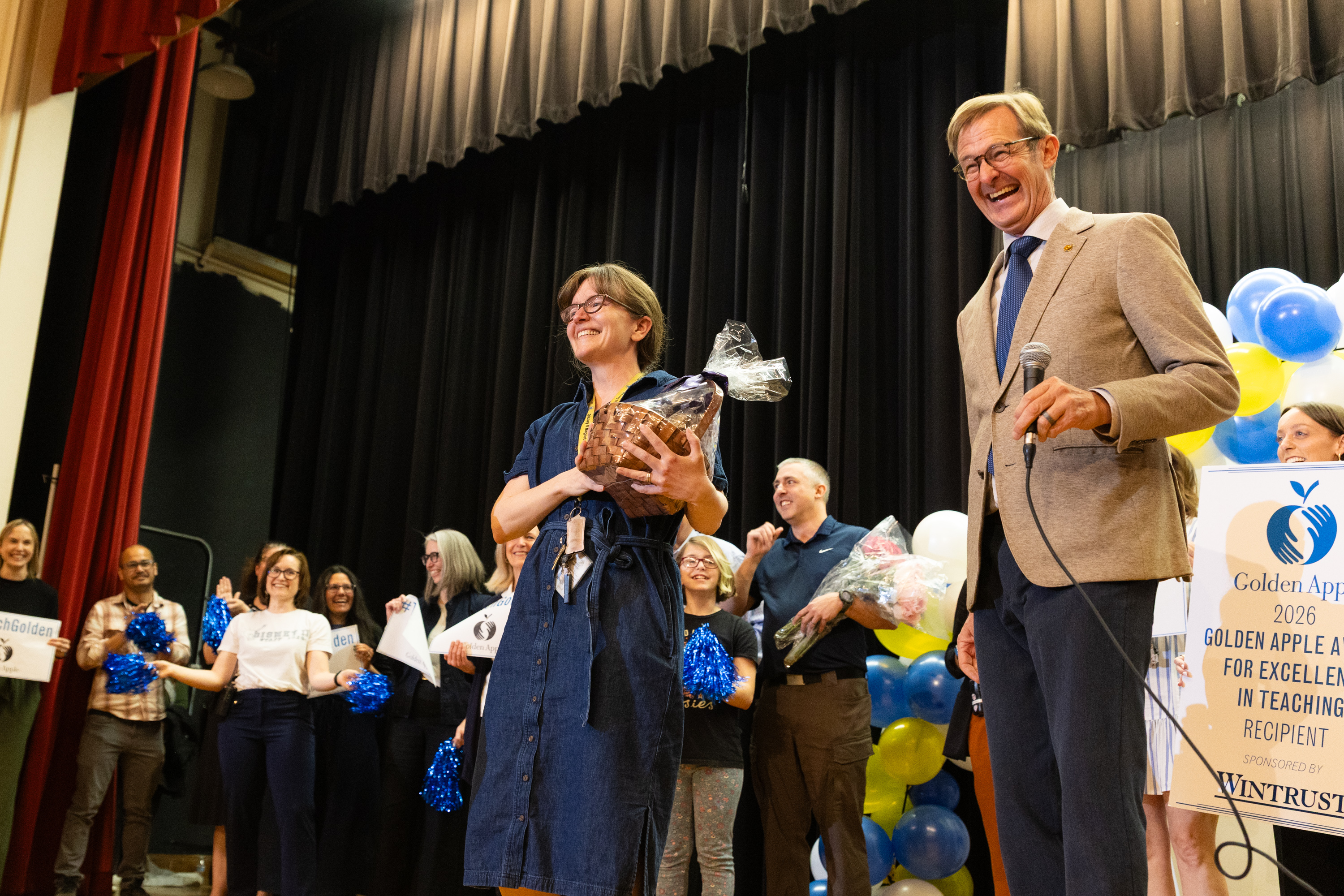 Ms. Debby on stage at her Golden Apple Award celebration