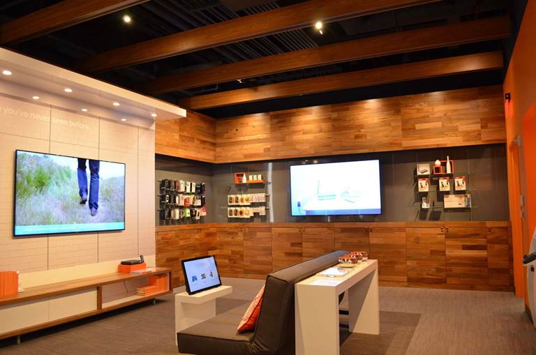 image of sofa and big screens