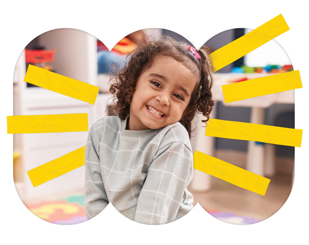 A three-year-old girl smiling, surrounded by yellow 'sunshine' rays.