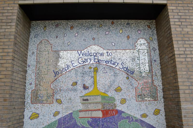 a mosaic mural of a school