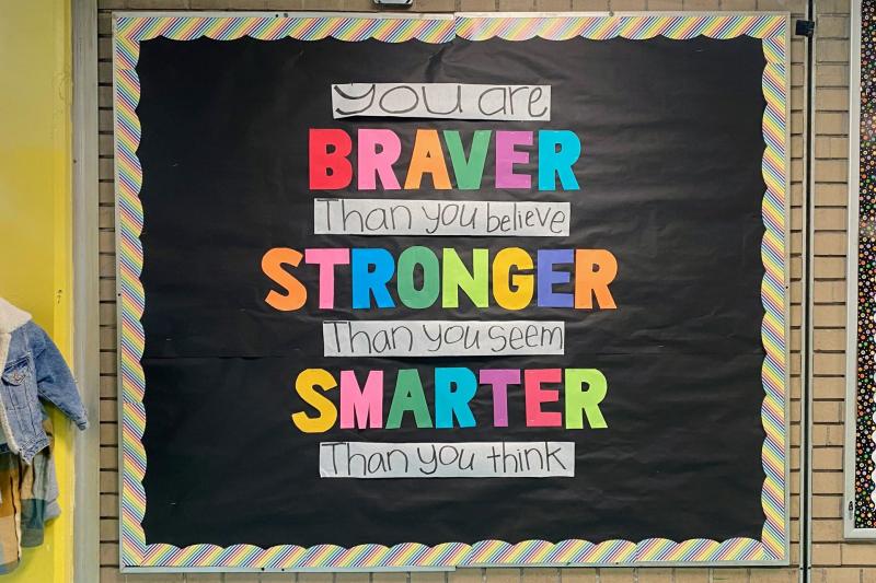 a bulletin board with colorful text