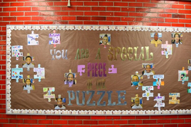 A board stating "You are a piece of the puzzle"