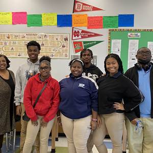 Six members of the Student Council Civics Club and their staff sponsor, Ms. Hill, pose for a photo inside of a classroom