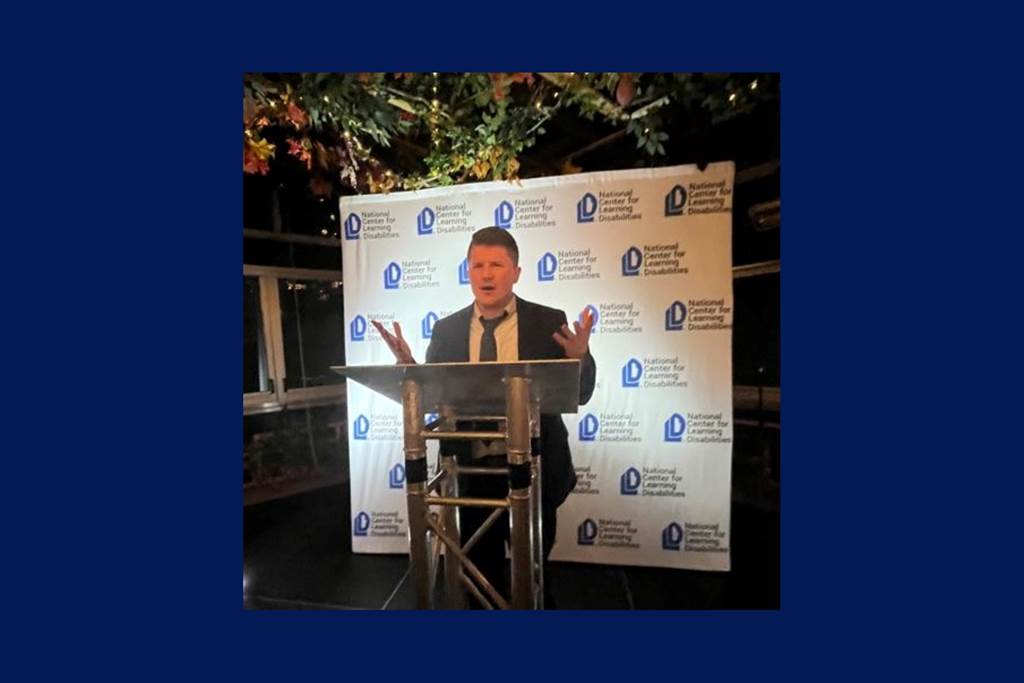 A photo of Joseph Rosen speaking at a podium