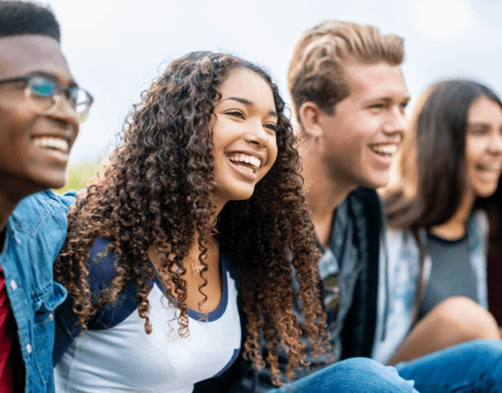 image of smiling students sitting together