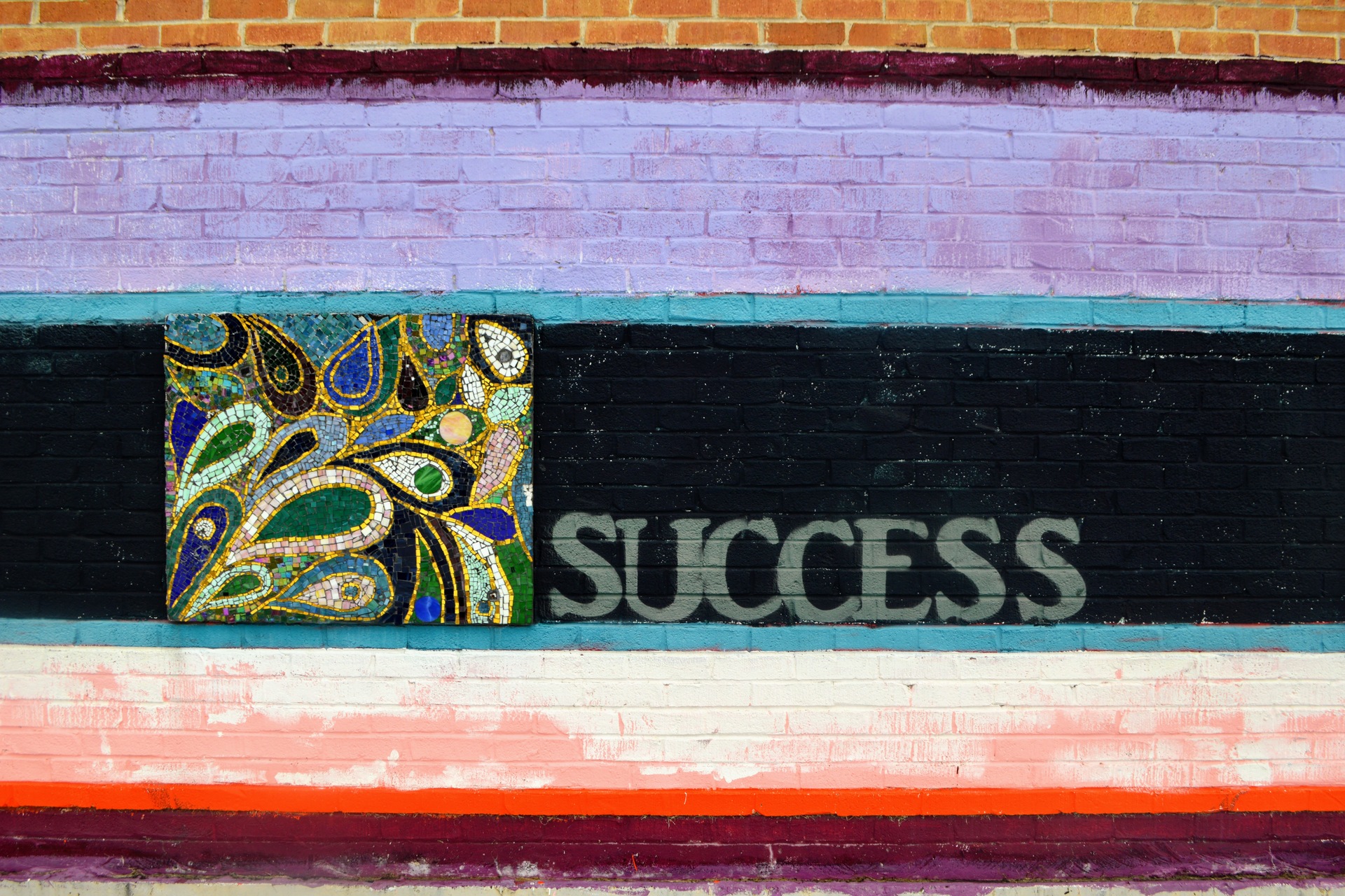A mural with word "success" in all caps