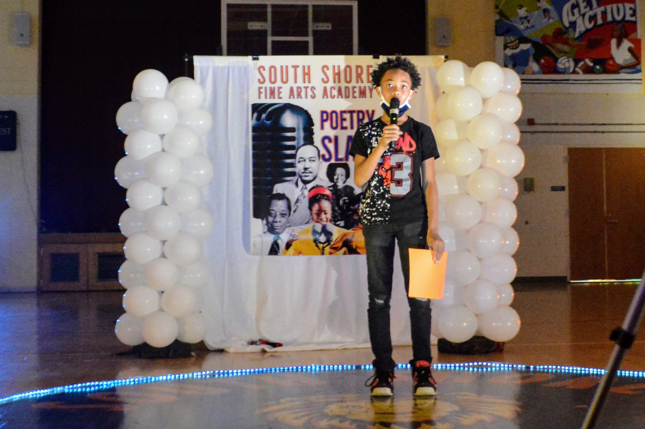 Student talking into a microphone