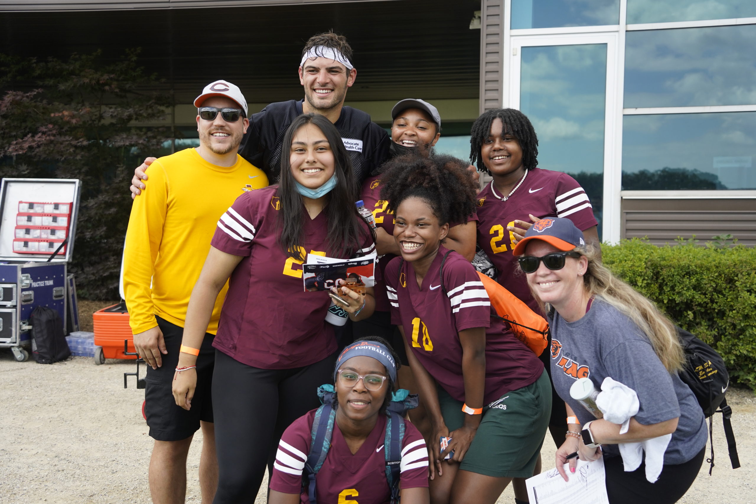 smiling students with a Chicago Bear