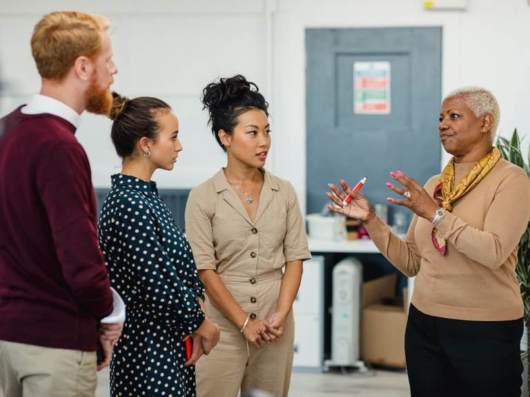 one person talking to three people