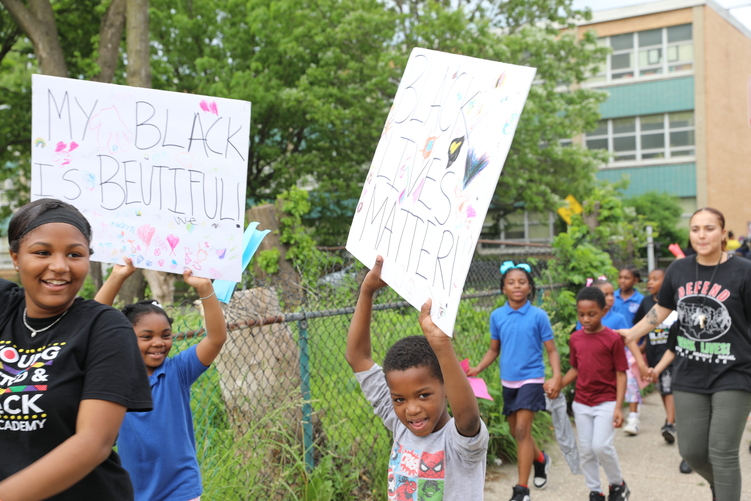 Students marching with signs