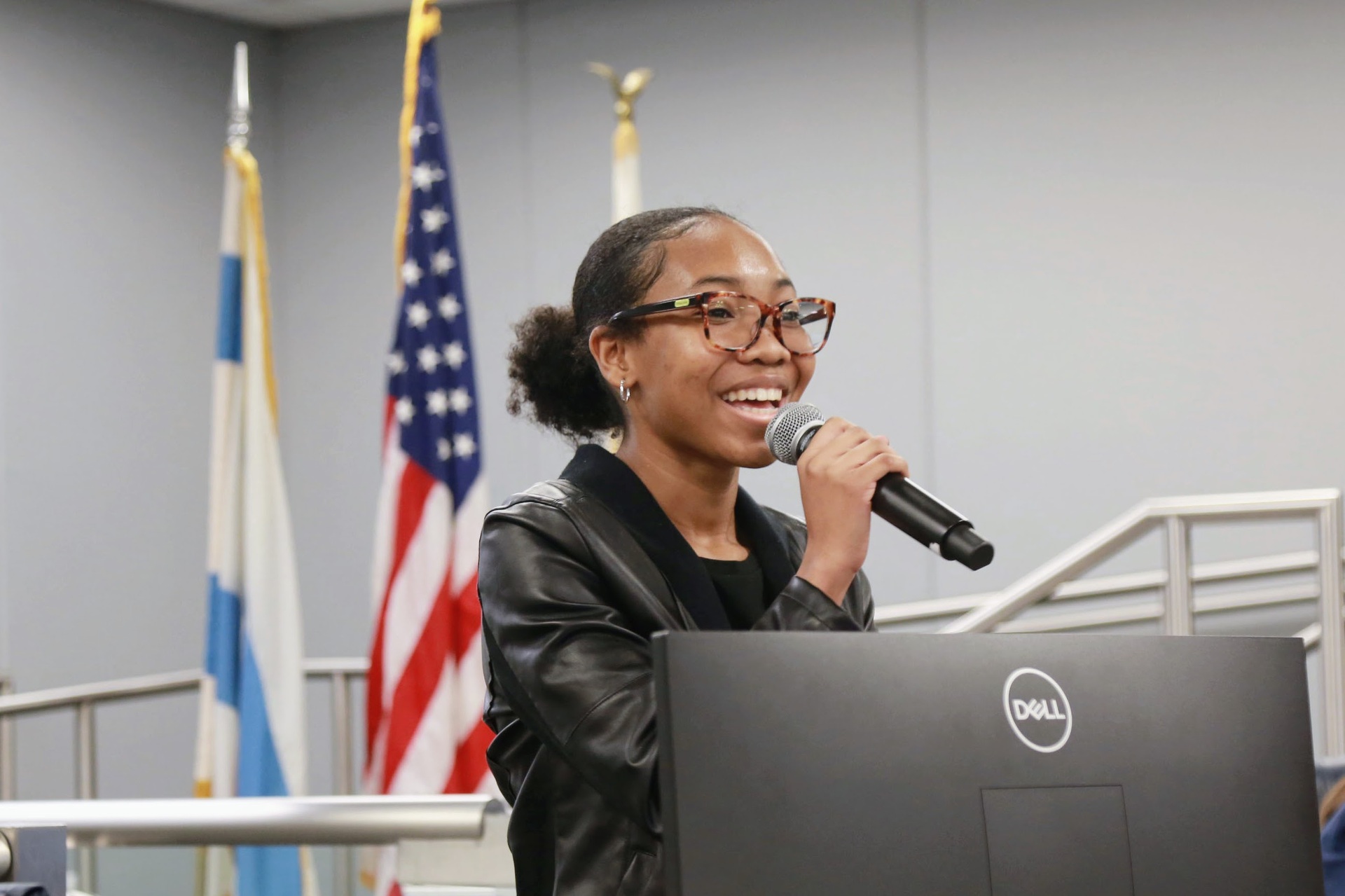 Student Board Member at microphone