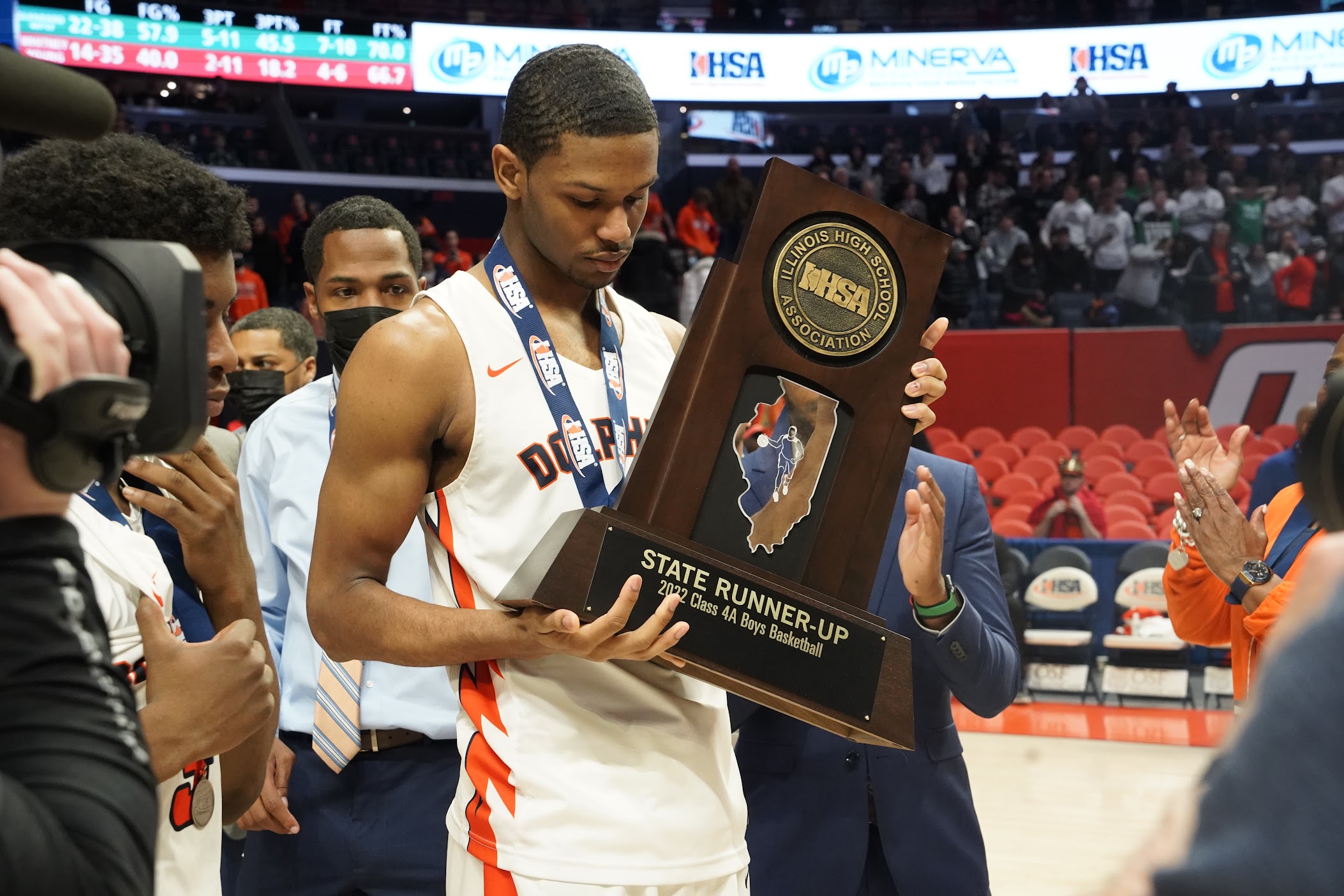 Dolphins' player holding a trophy