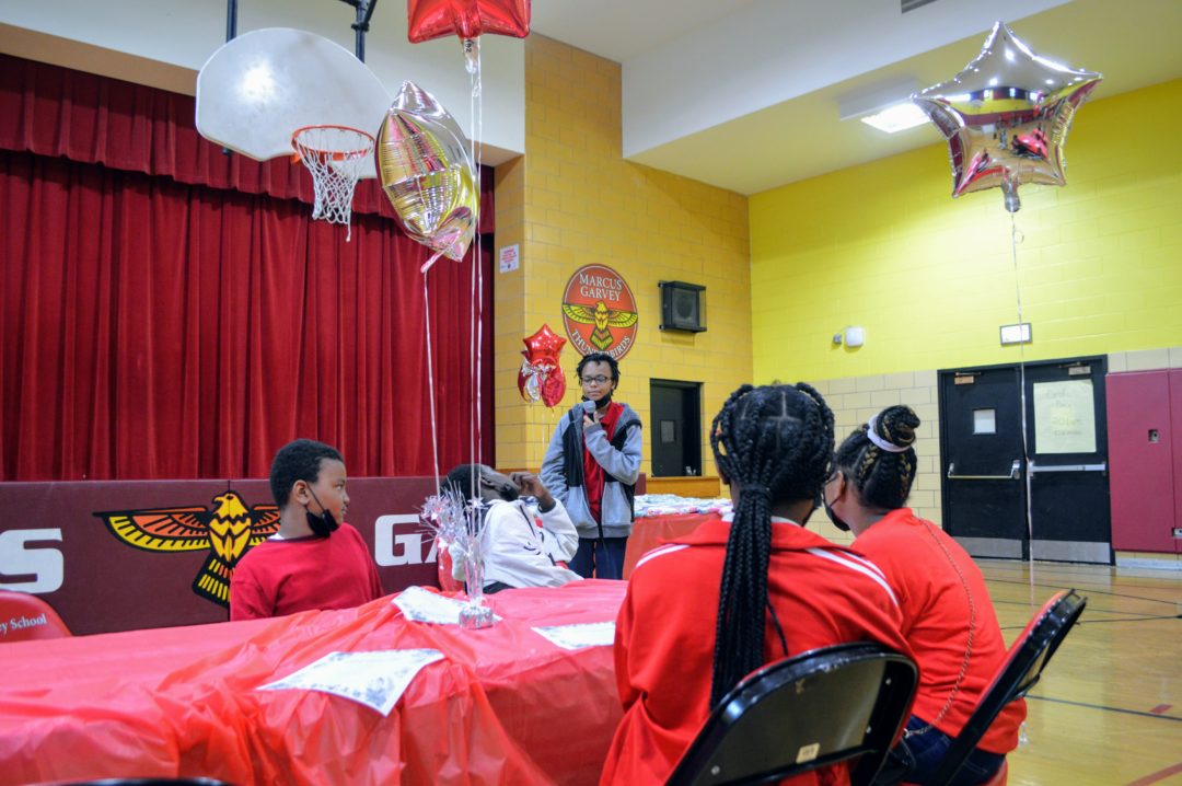 image of student speaking in gymnasium