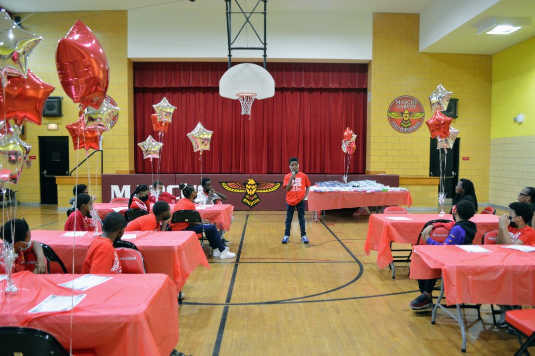 image of student speaking in gymnasium