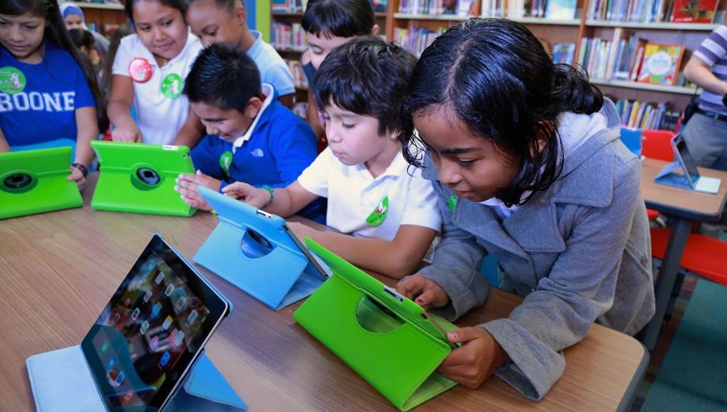 image of students in library at computers