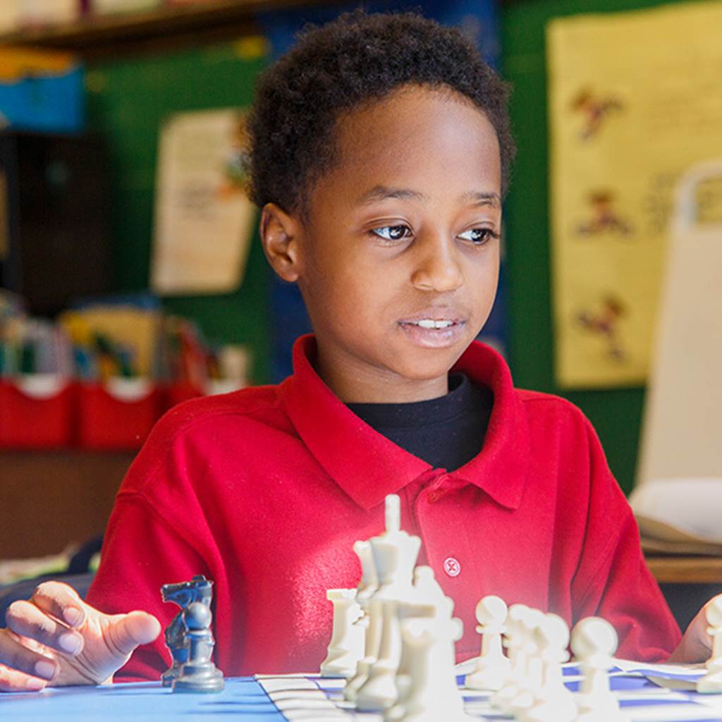 Boy playing chess