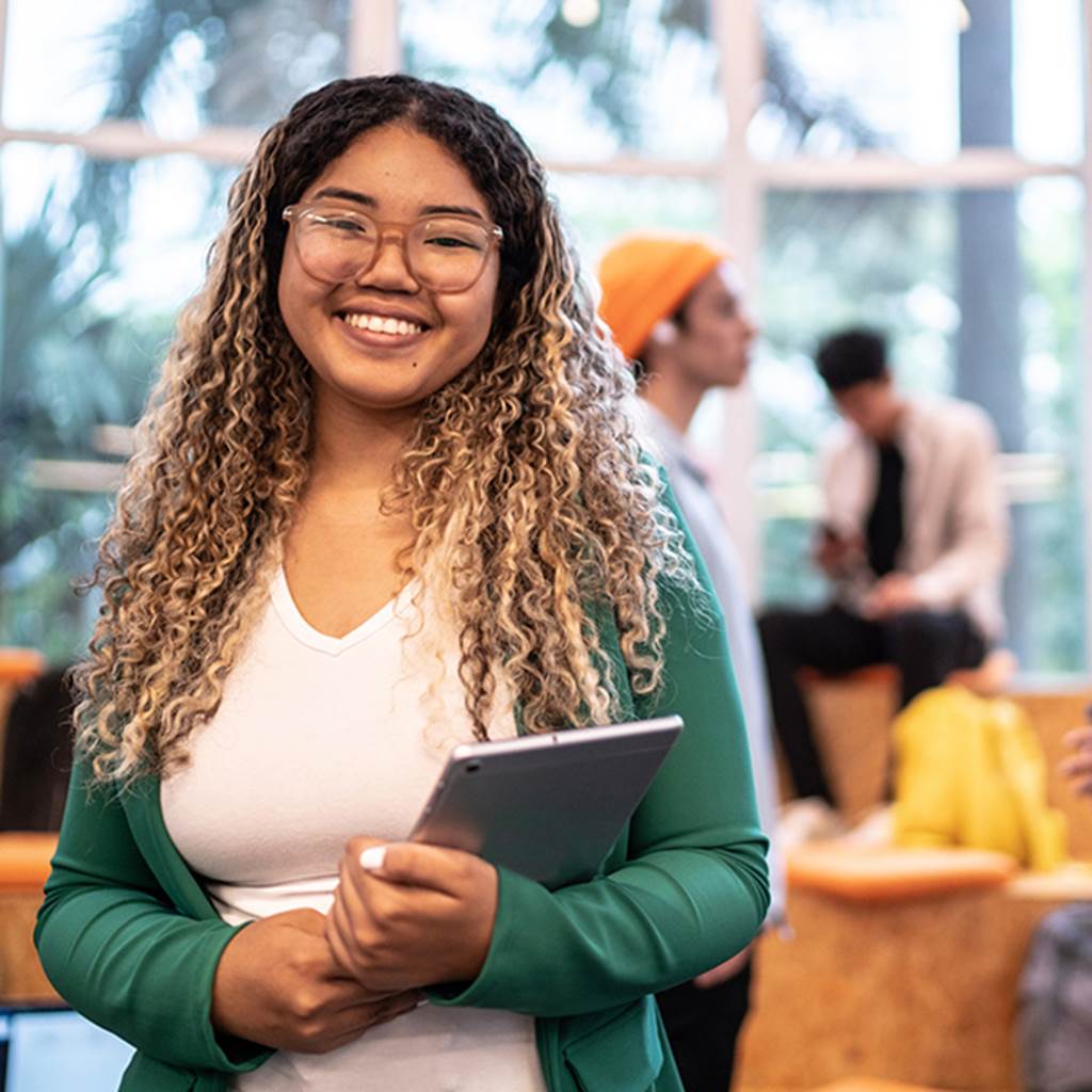 A student holds a tablet