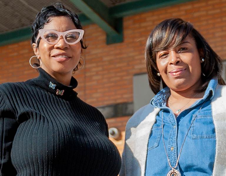 CPS teachers stand outside a school