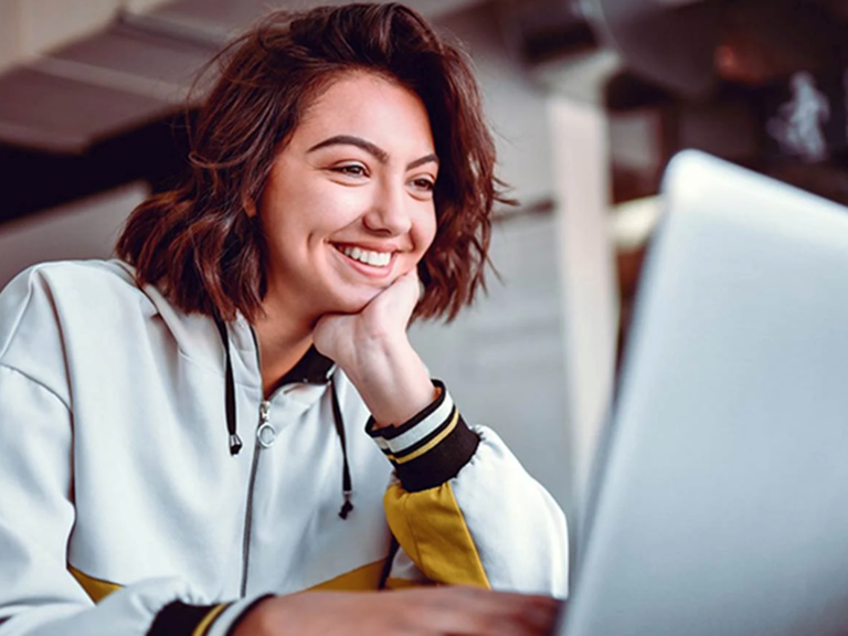 Girl looking at a laptop computer screen