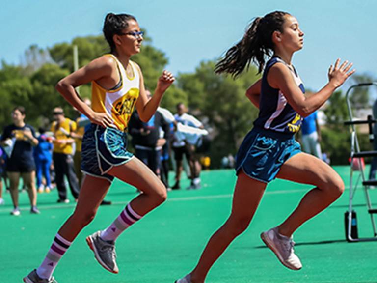 Students run at a track meet
