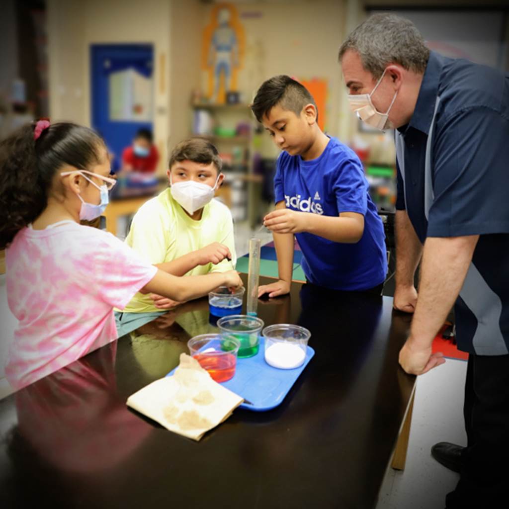 Students performing a science experiment