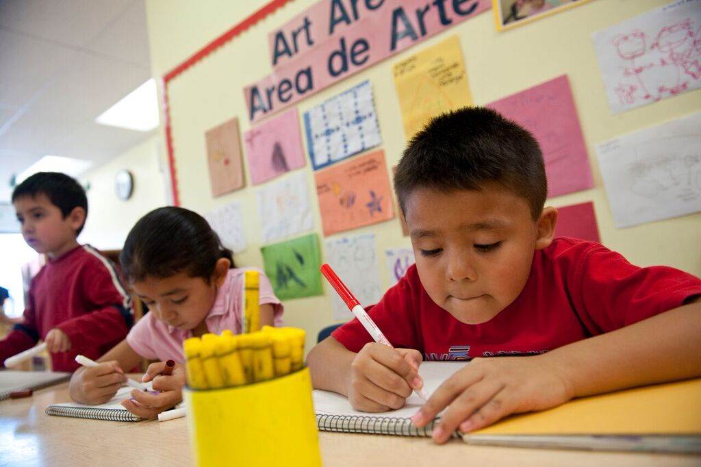 image of young boy coloring
