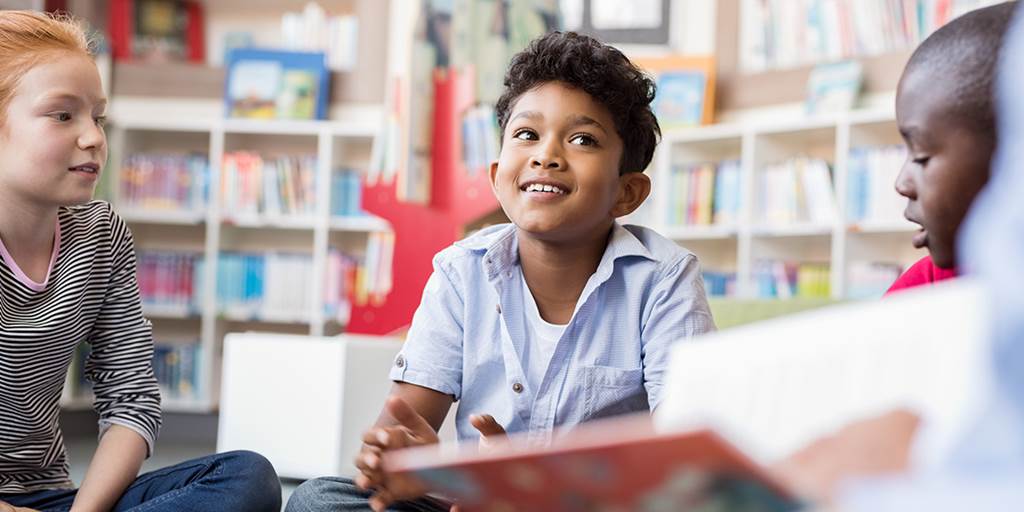 Children talking about a book