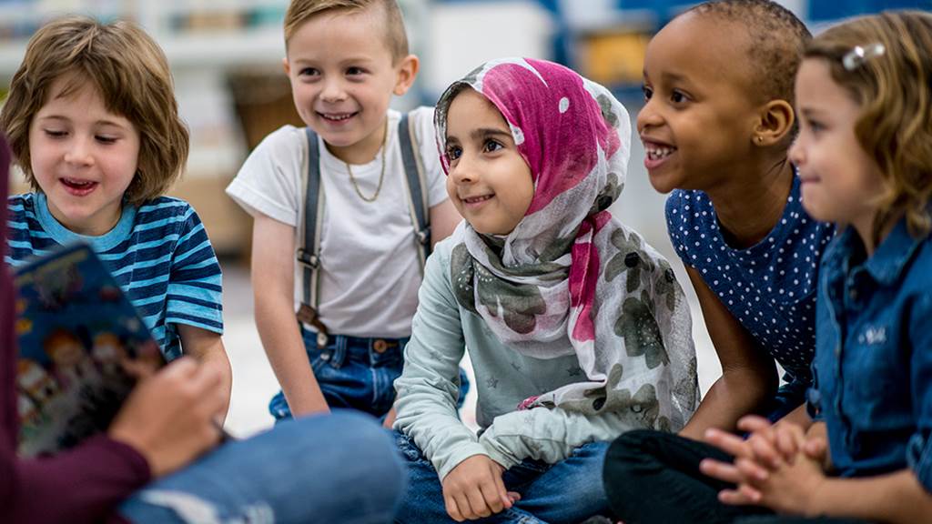 Group of children listening to a story