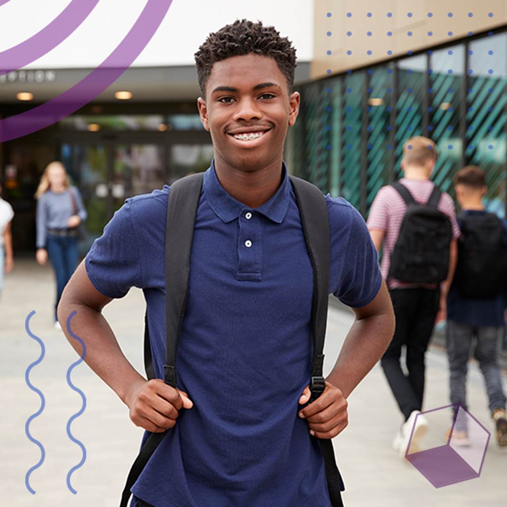 image of smiling student outside school