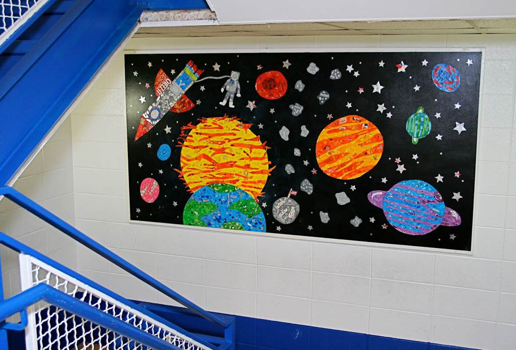 painting of the planets in school stairway