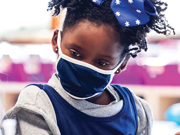 Image of a young student wearing a face mask