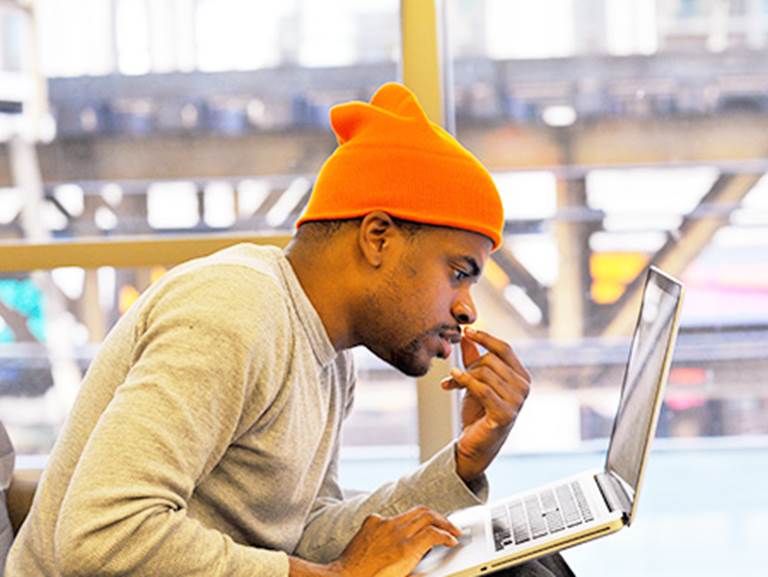 A CPS student works on a computer