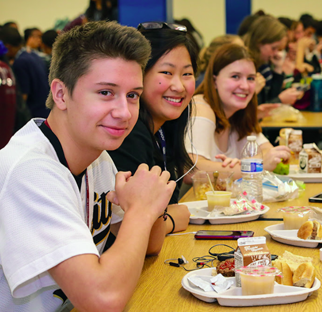 Students eat at a lunch table