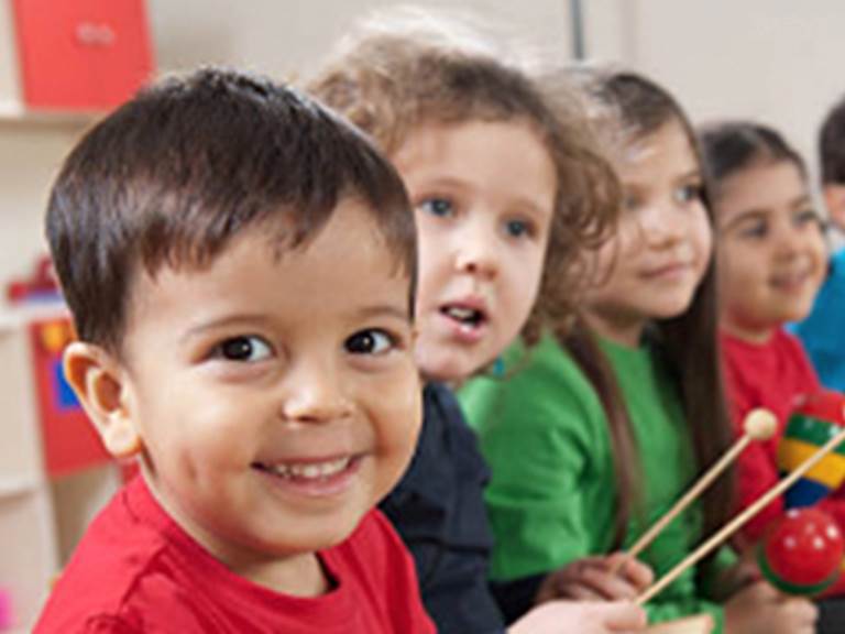 Five kids playing with musicial instruments