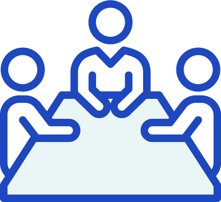 Three people sitting at a table.