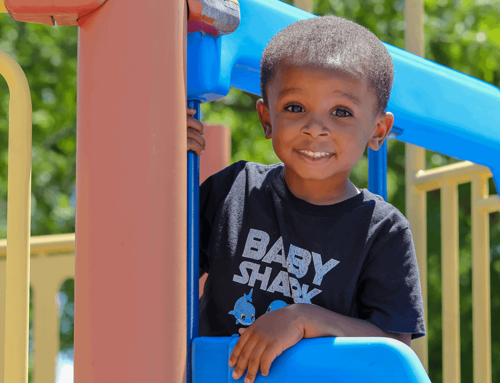 image of smiling boy in playground