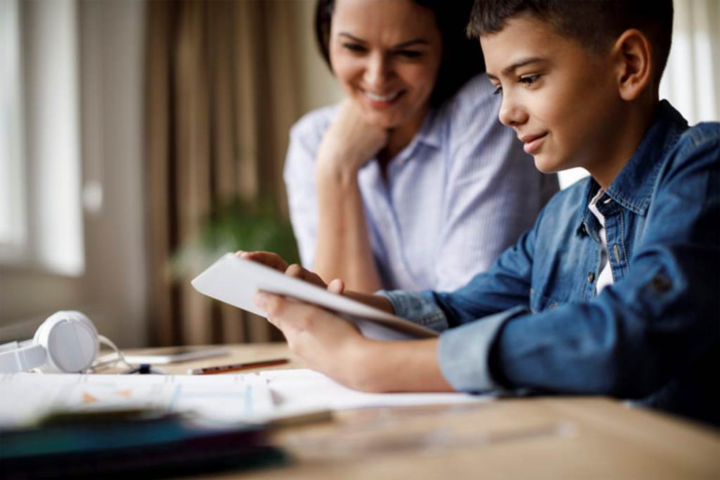 Student and parent looking at a tablet