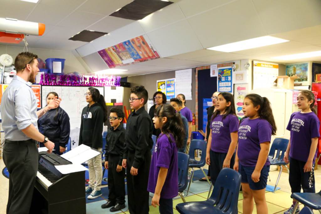 A class of students singing