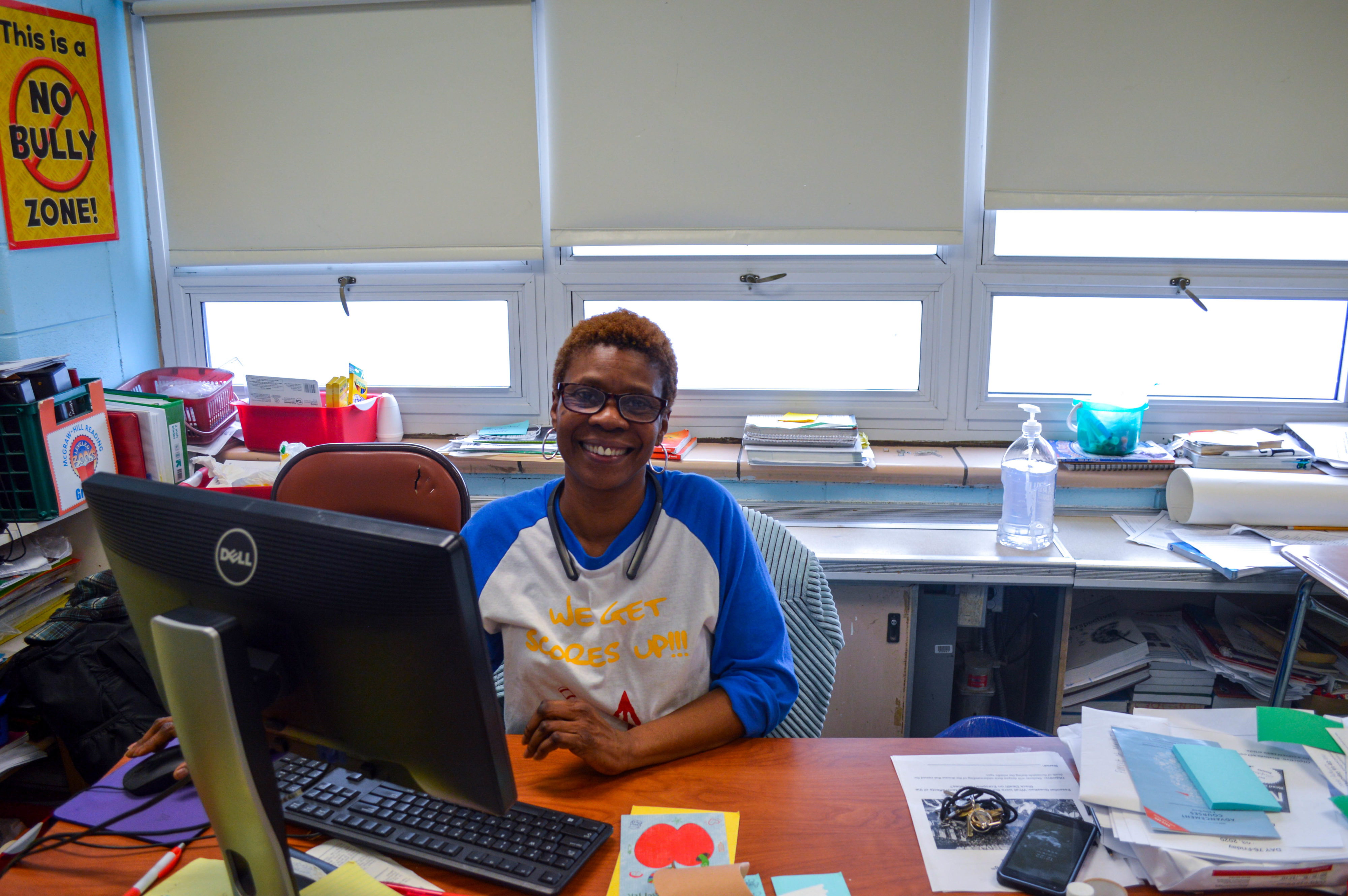 A teacher sitting at her desk