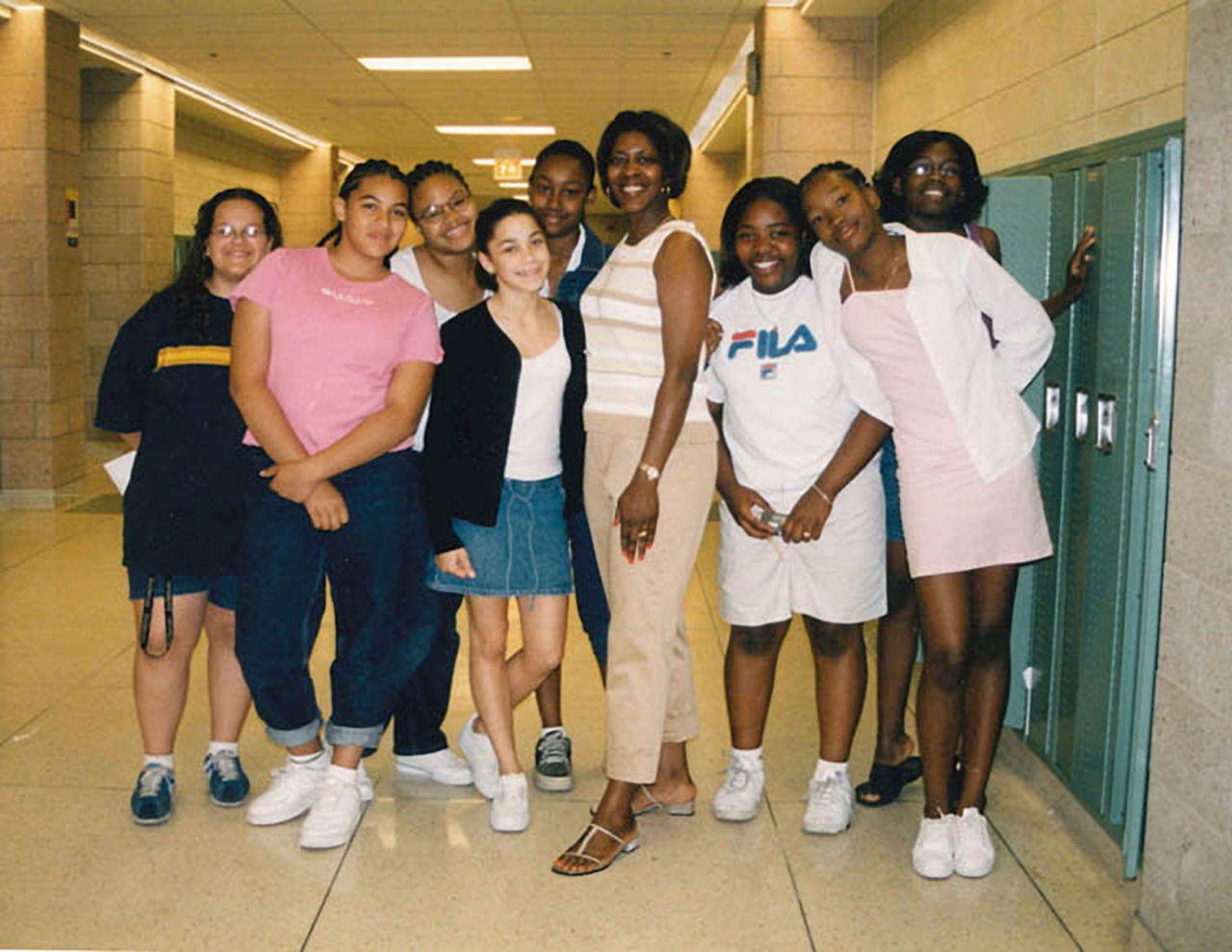 Dra. Karnen Saffold standing with students